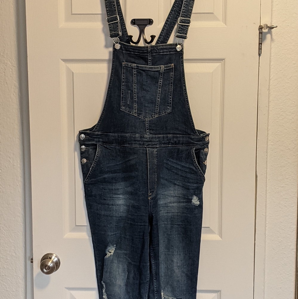 Distressed denim overalls